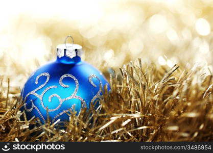 blue christmas ball on golden background