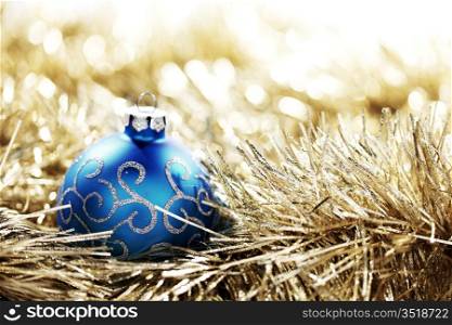 blue christmas ball on golden background