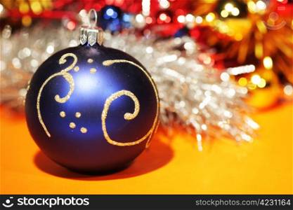 Blue christmas ball with gold pattern isolated on abstract background