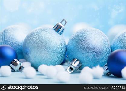blue christmas balls over blurred background