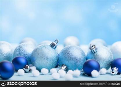 blue christmas balls over blurred background