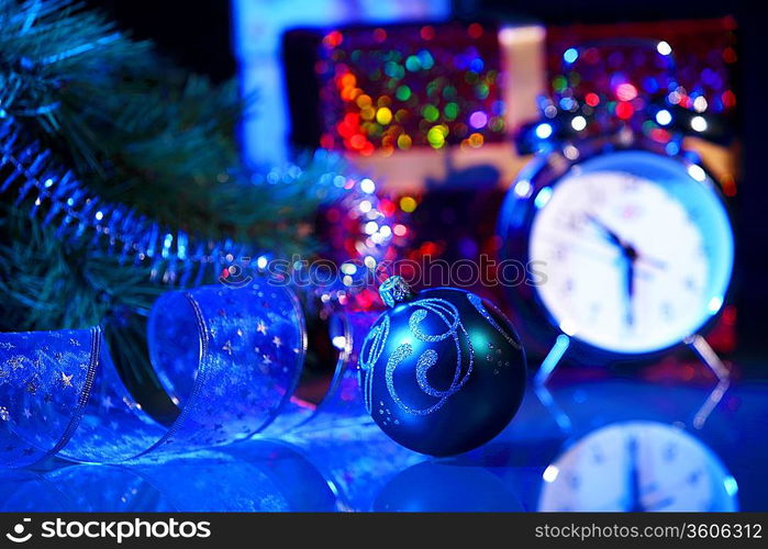 Blue Christmas collage. Ball and ribbon on a blue background.