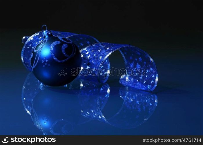 Blue Christmas collage. Blue Christmas collage. Ball and ribbon on a blue background.