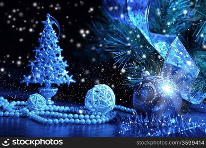 Blue Christmas collage. Decorations and ribbons on a blue background