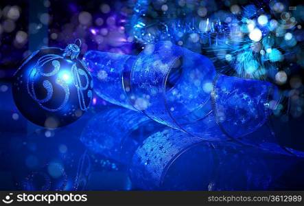 Blue Christmas collage. Decorations and ribbons on a blue background