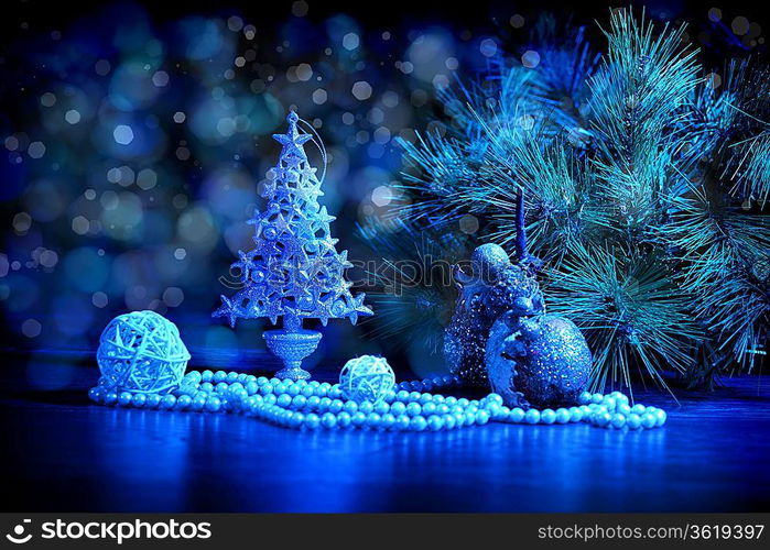 Blue Christmas collage. Decorations and ribbons on a blue background