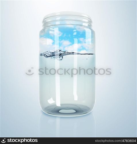 Blue clean ocean wave inside a glass jar