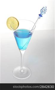 Blue cocktail with lemon slice