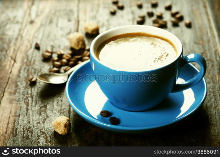 Blue coffee cup on vintage wooden background