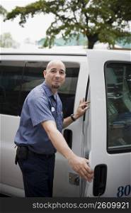 Blue collar worker getting in van