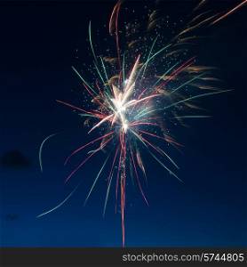 Blue colorful fireworks on night sky background