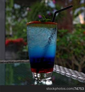 blue curacao cocktail with fresh lemon and mint leaf