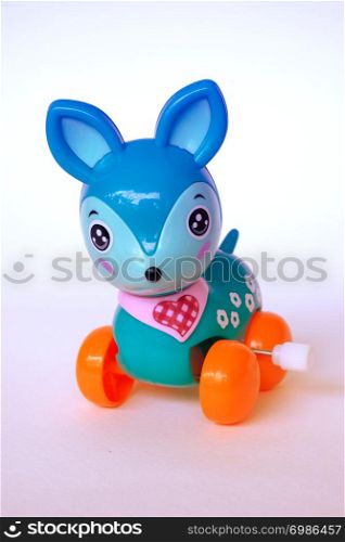 blue deer wind up toy plastic on isolated white background