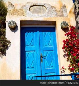 blue door in antique village santorini greece europe and white wall