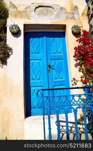 blue door in antique village santorini greece europe and white wall