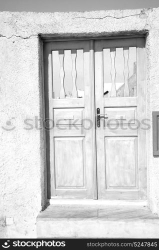 blue door in antique village santorini greece europe and white wall