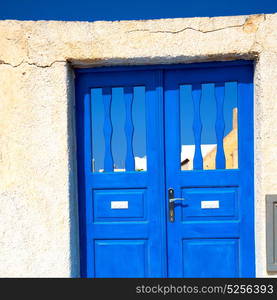 blue door in antique village santorini greece europe and white wall