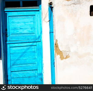 blue door in antique village santorini greece europe and white wall