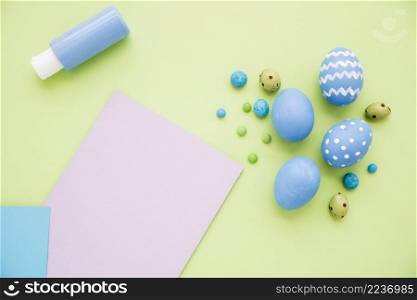 blue easter eggs with paper sheet table