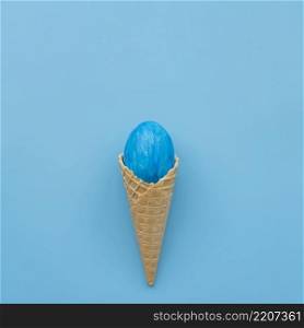 blue egg waffle cone blue background