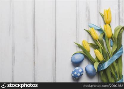 blue eggs near tulips