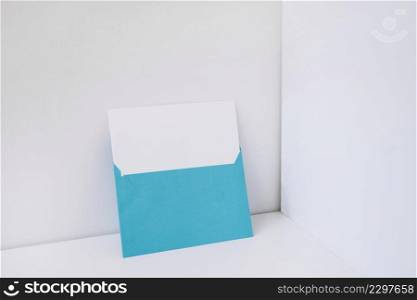 blue envelope with paper inside