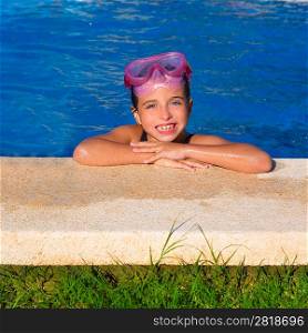 Blue eye kid girl on on blue pool poolside smiling with snorkel glasses