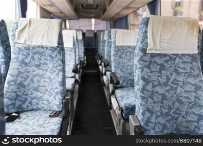 blue fabric vehicle seat in interior mini bus