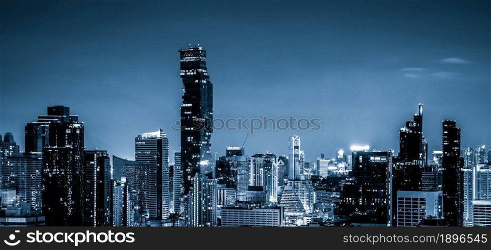 Blue-filtered cityscape and high-rise buildings in metropolis city center . Downtown business district in panoramic view .. Blue-filtered cityscape and high-rise buildings in metropolis city center
