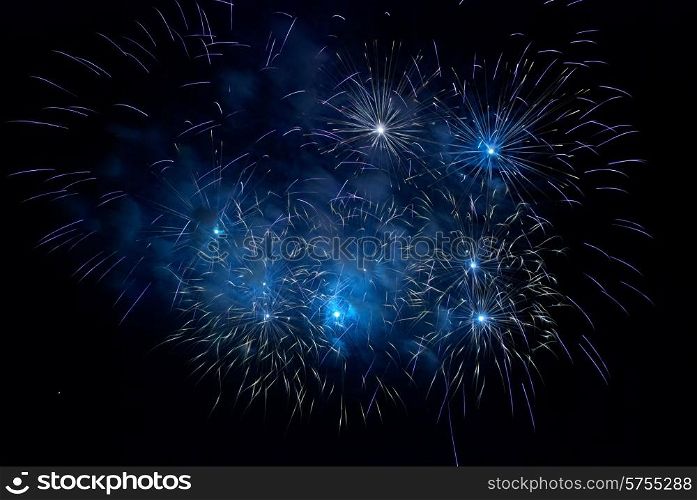 Blue fireworks on the black sky background