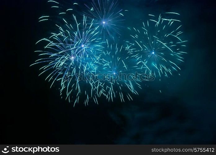 Blue fireworks on the black sky background