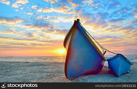 blue fisherman boats and sunrise