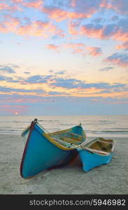 blue fisherman boats and sunrise