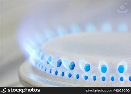 Blue flames of a gas stove.