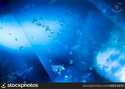 Blue gem under the microscope. Closeup macro photography.