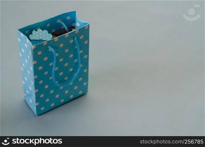 Blue Gift box is on the light blue background,copy space,