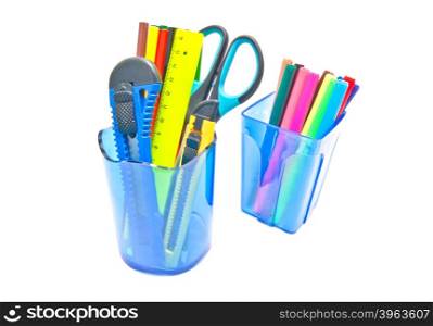 blue glasses with office supplies on white