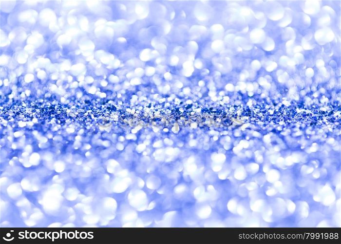 Blue glitter background. Blue glitter defocused background with copy space