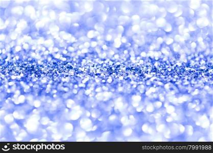 Blue glitter background. Blue glitter defocused background with copy space