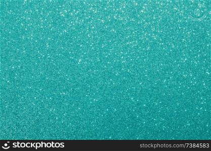 blue glitter macro background. Close-up shot of glittery texture.. blue glitter macro background