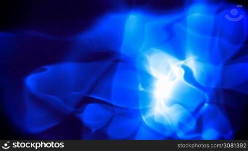 Blue glowing smoke over black background