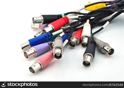 Blue, green, yellow, white, RCA, cables and plugs isolated on white
