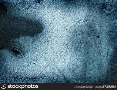 Blue grungy background with crack and black paint