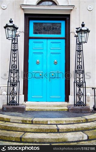 blue handle in london antique door rusty brass nail and light