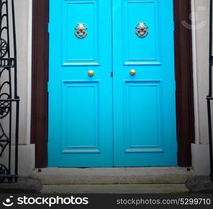 blue handle in london antique door rusty brass nail and light