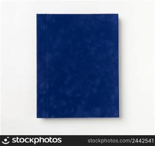 Blue hardcover book, isolated on white background. Top view. book album on a white background