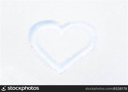 Blue heart shape drawing on white snow. Blue heart shape drawing on white snow as love valentine background