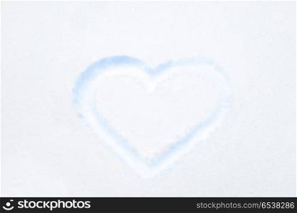 Blue heart shape drawing on white snow. Blue heart shape drawing on white snow as love valentine background