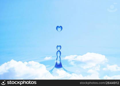 Blue heart shaped water droplets falling into the sky