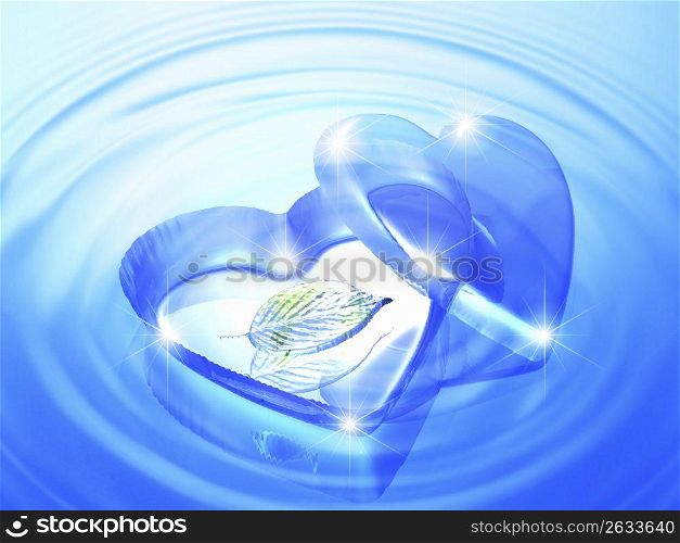 Blue heart shapeed tray with a leaf inside, laying on rippled blue water